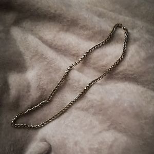Intricate silver tone necklace